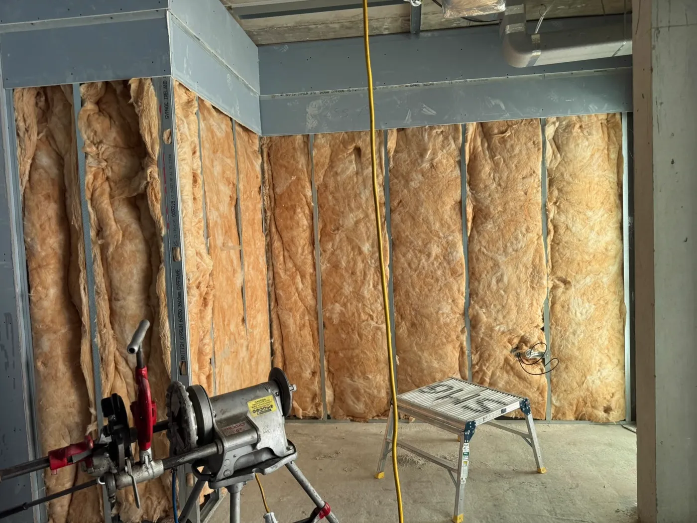Mineral wool insulation between metal studs